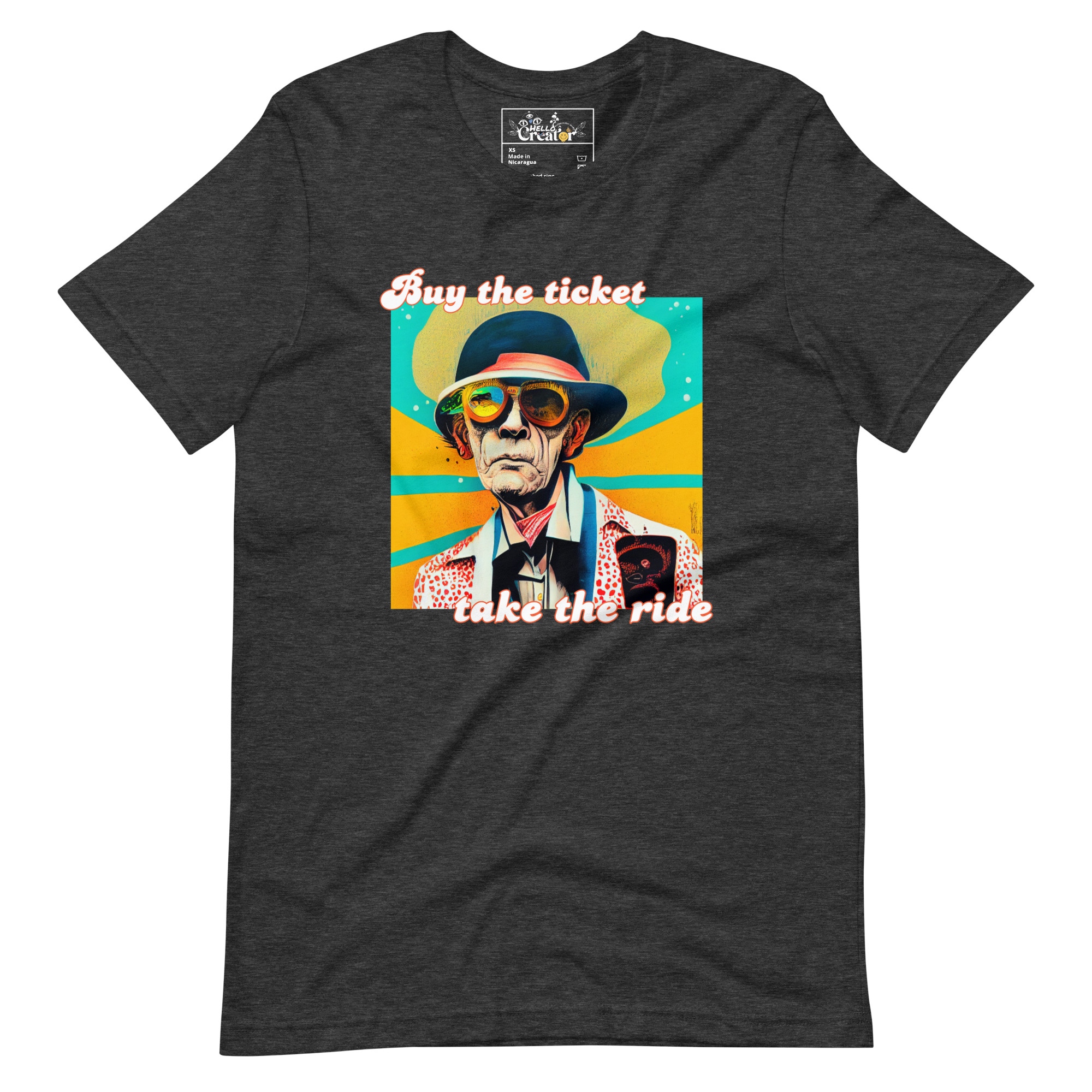 unisex-staple-t-shirt-dark-grey-heather-front-637e9a6c8427b.jpg Celebrate the life and legacy of Hunter S. Thompson with our 'Buy the Ticket, Take the Ride' t-shirt. This shirt features a cartoonish artist's rendition of the acclaimed writer as an older man, paired with the unforgettable phrase 'Buy the Ticket, Take the Ride.' Made from premium materials, this t-shirt is both comfortable and durable, ensuring that you can wear it for years to come. Whether you're a die-hard fan or simply admire Thompson's work, this unique t-shirt is sure to become a favorite in your collection. - Dark Grey heather t-shirt